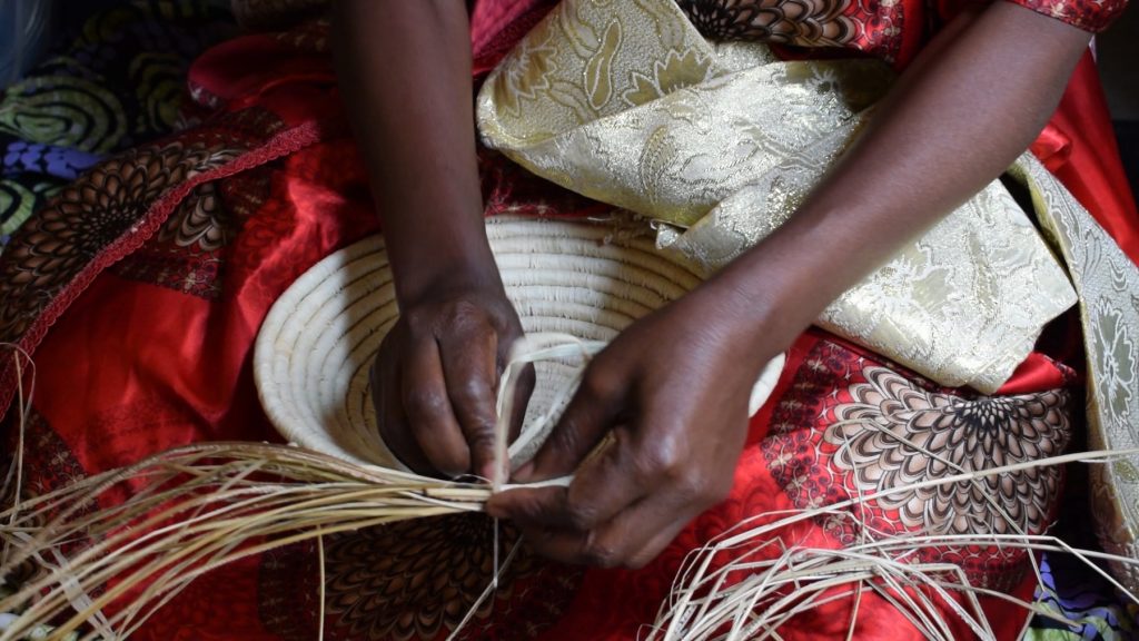 Basket Weaving natural on red dress | AFRICAN BASKETS AUSTRALIA WHOLSALE | AFRIBEADS