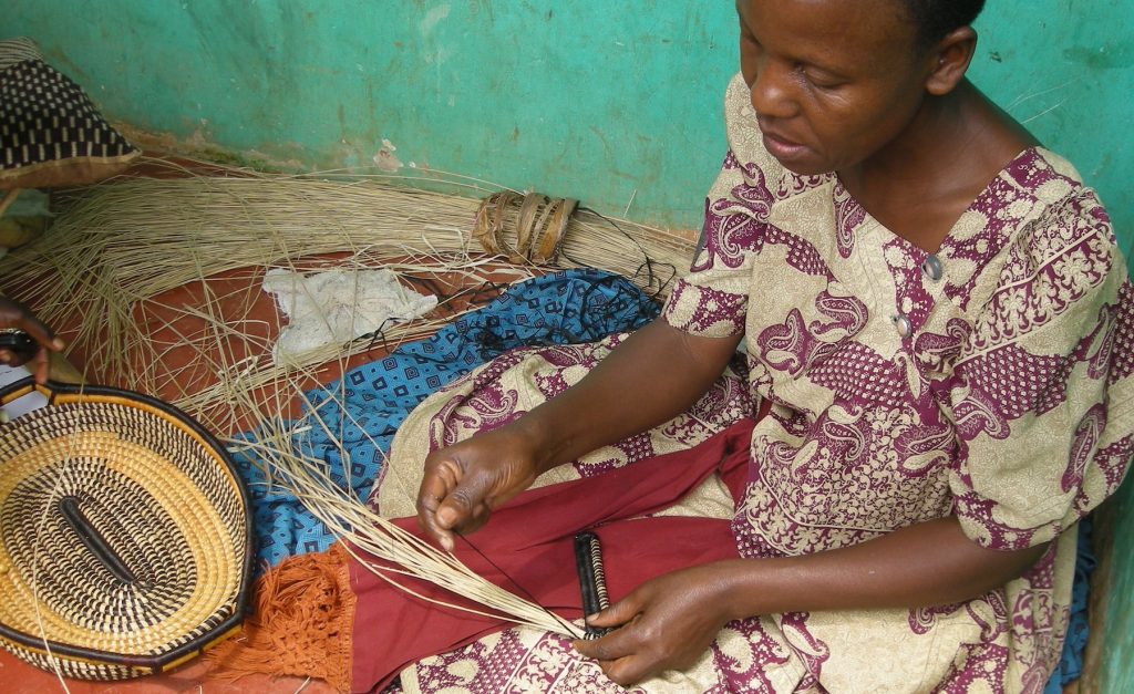 One of the Afribeads Artisans at work basket weaving | AFRICAN BASKETS AUSTRALIA WHOLSALE | AFRIBEADS